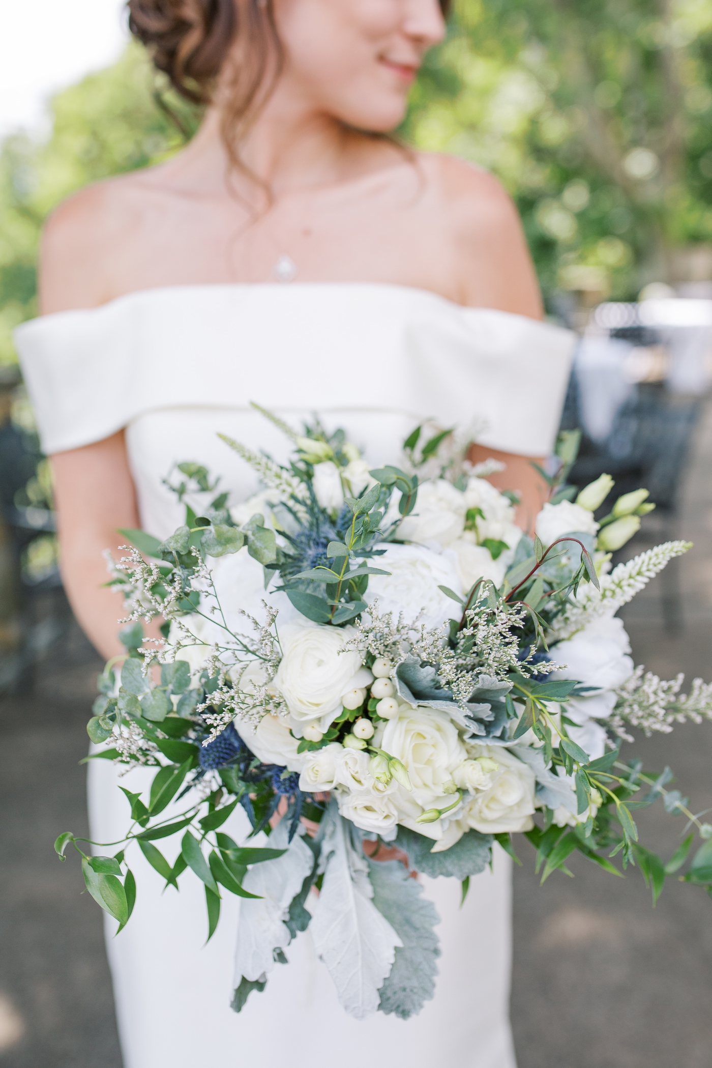 Bridal bouquet with white roses, dusty miller and sea holly