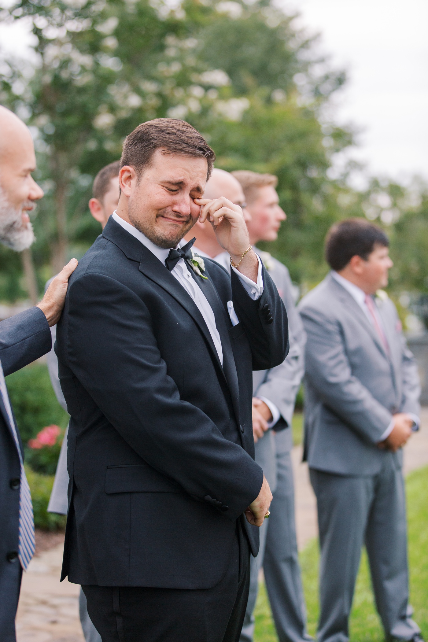 Groom crying at ceremony 